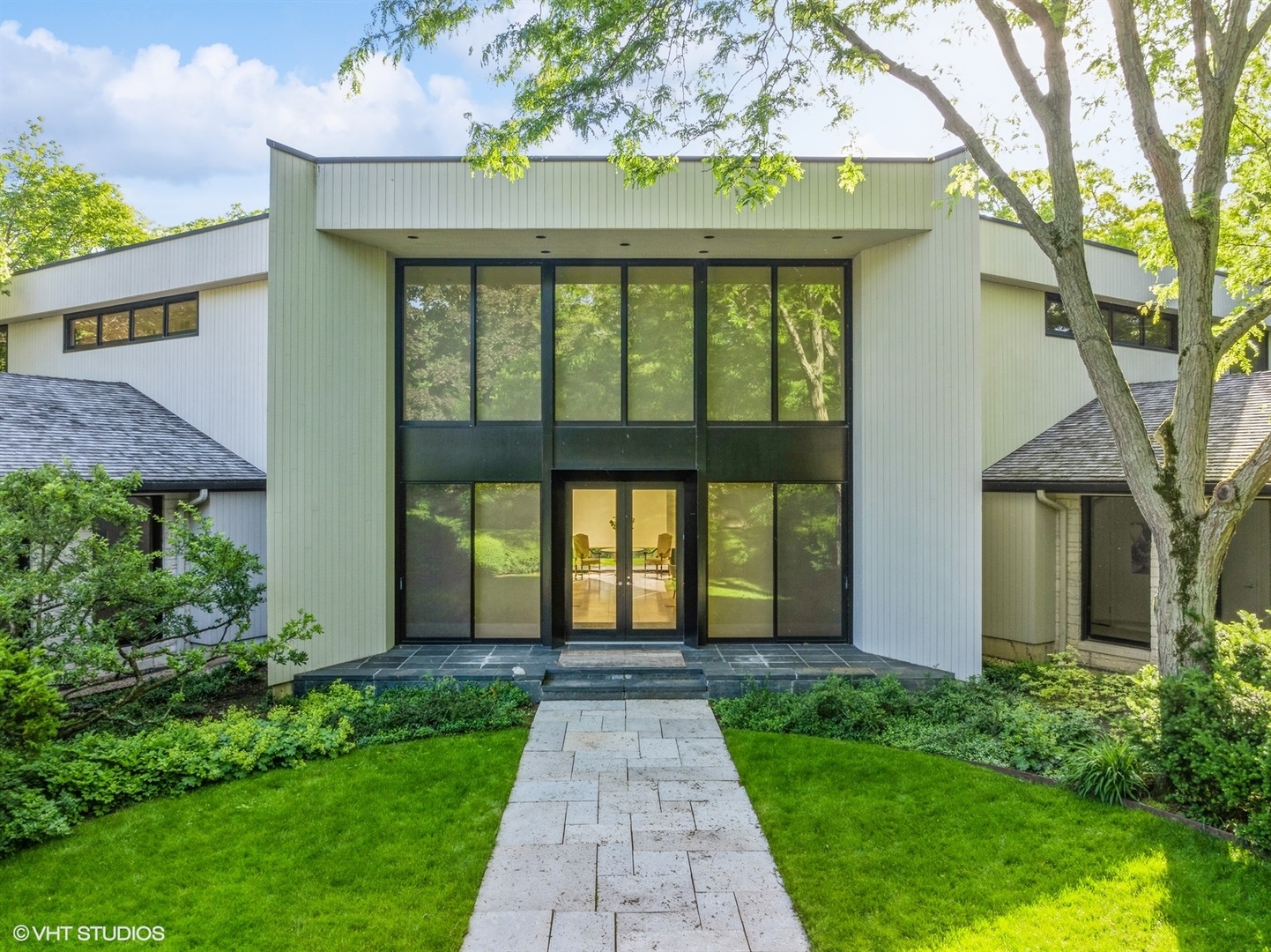 a front view of a house with a yard