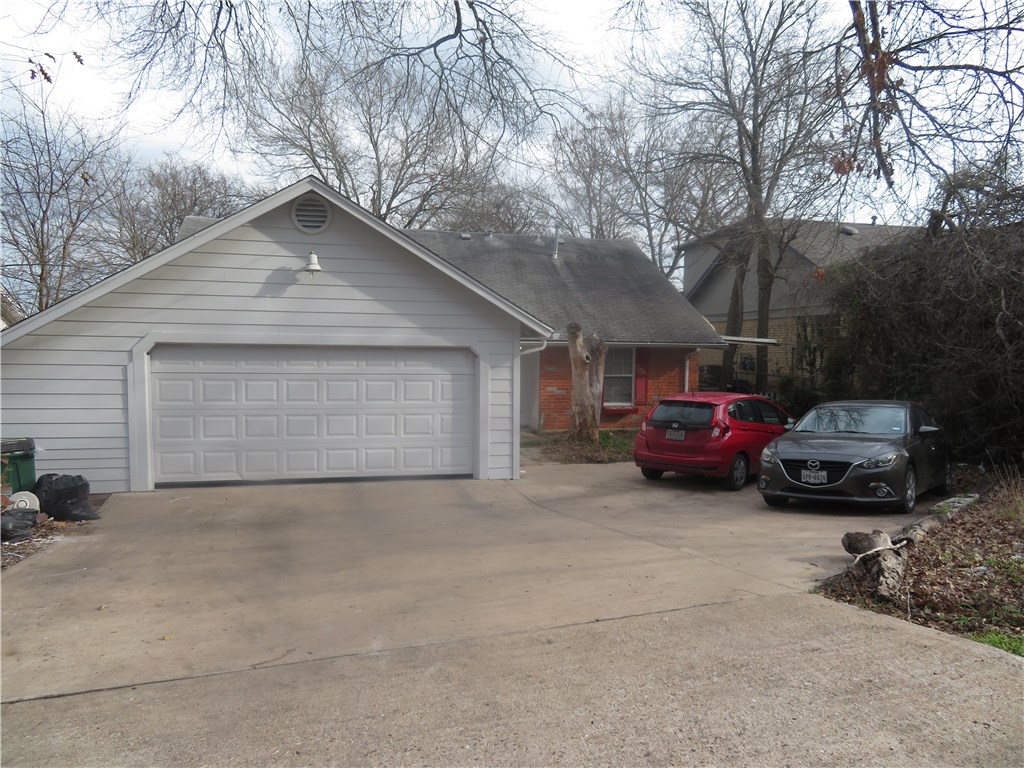 a view of a car in front of house