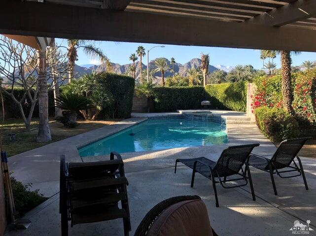 a view of a chairs and table in patio