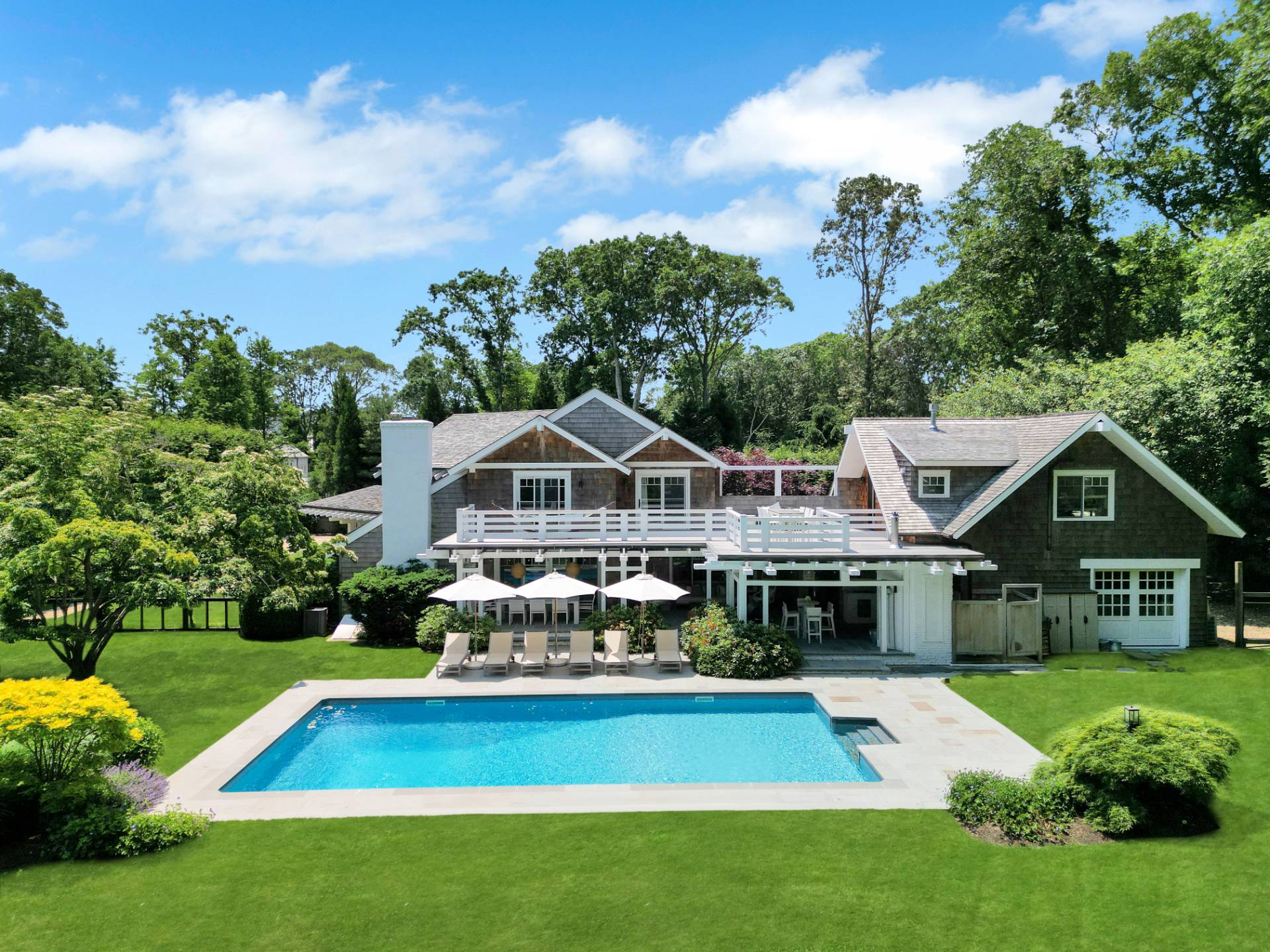 a front view of house with yard and green space