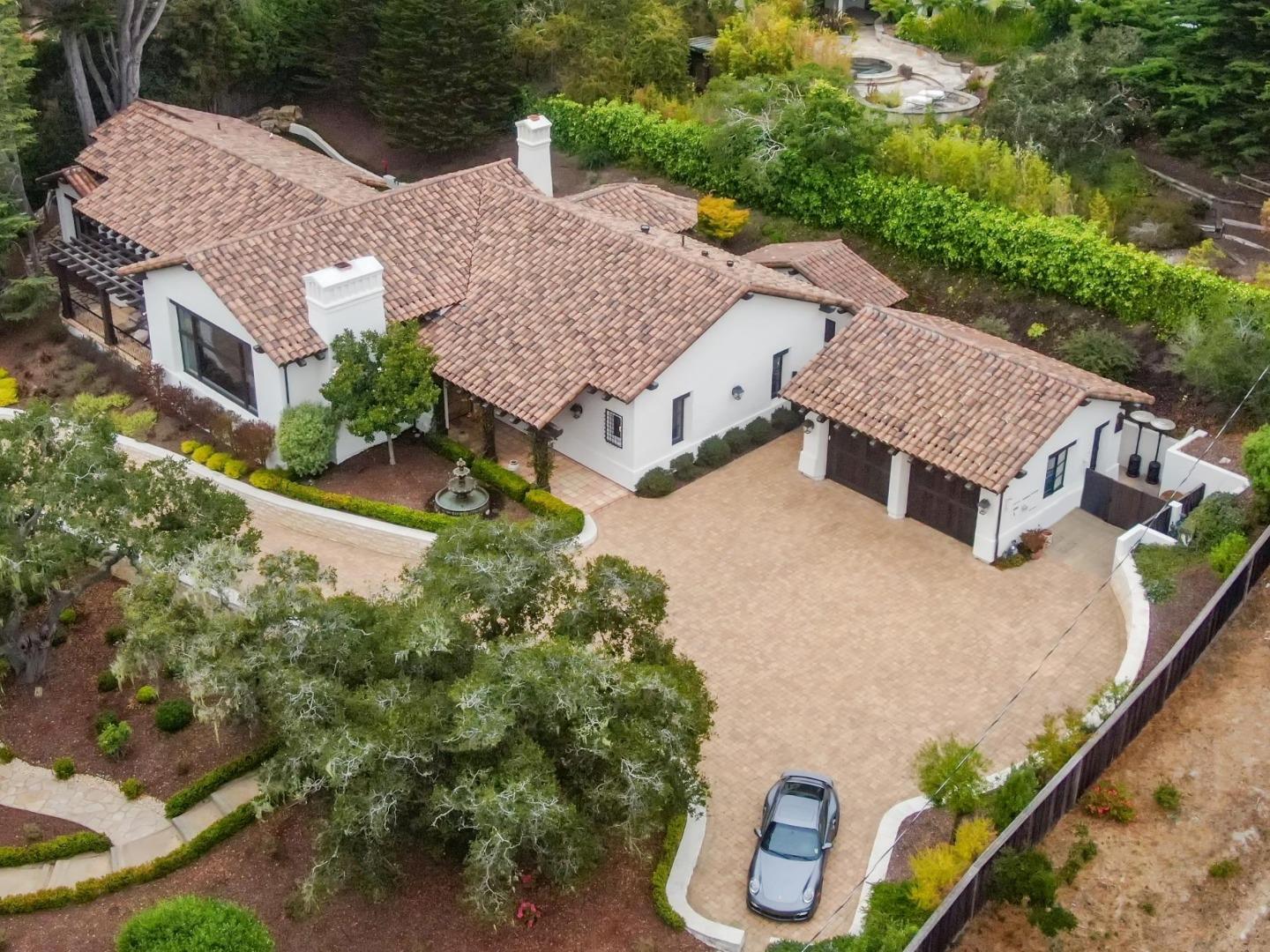 an aerial view of multiple houses with yard