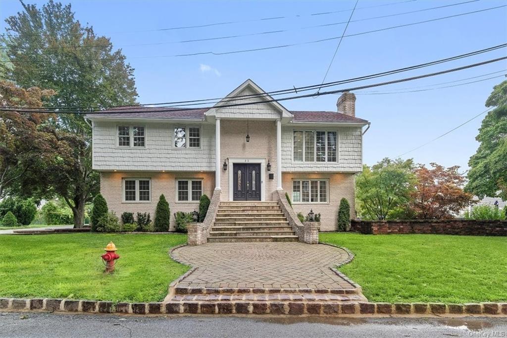 Bi-level home with a front yard