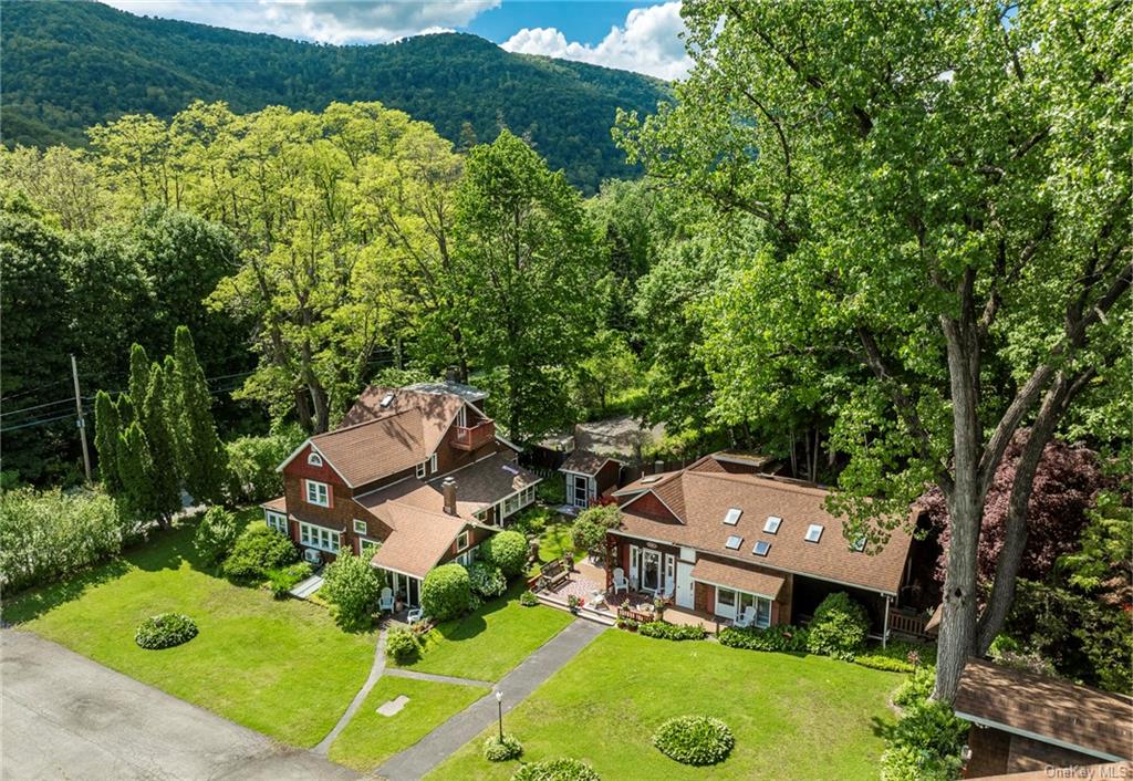 an aerial view of a house with yard swimming pool and outdoor seating