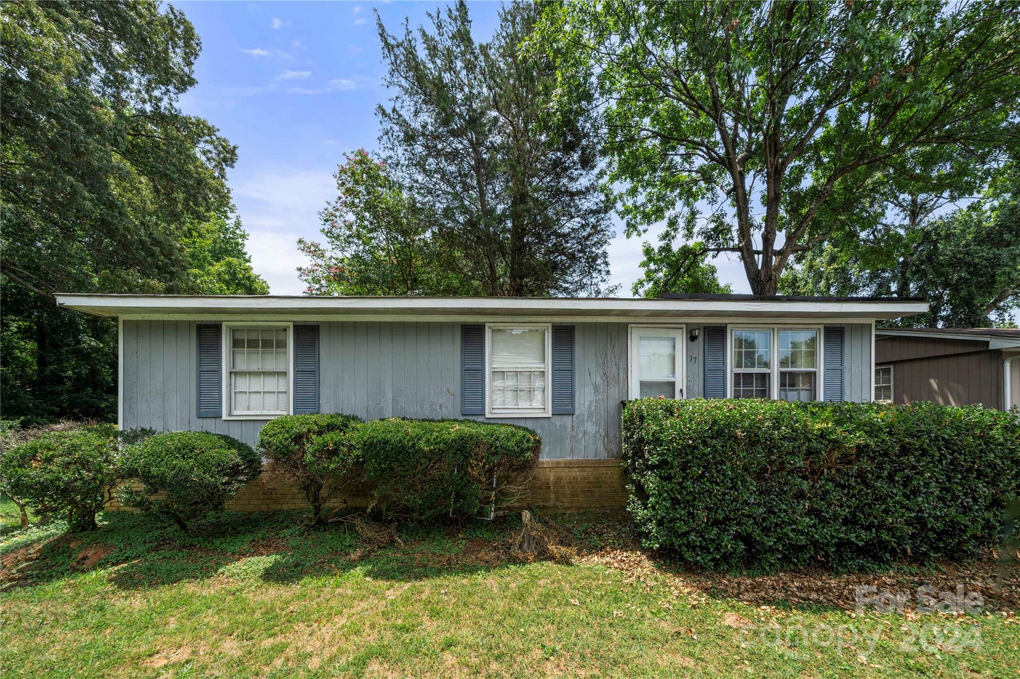 front view of a house with a yard