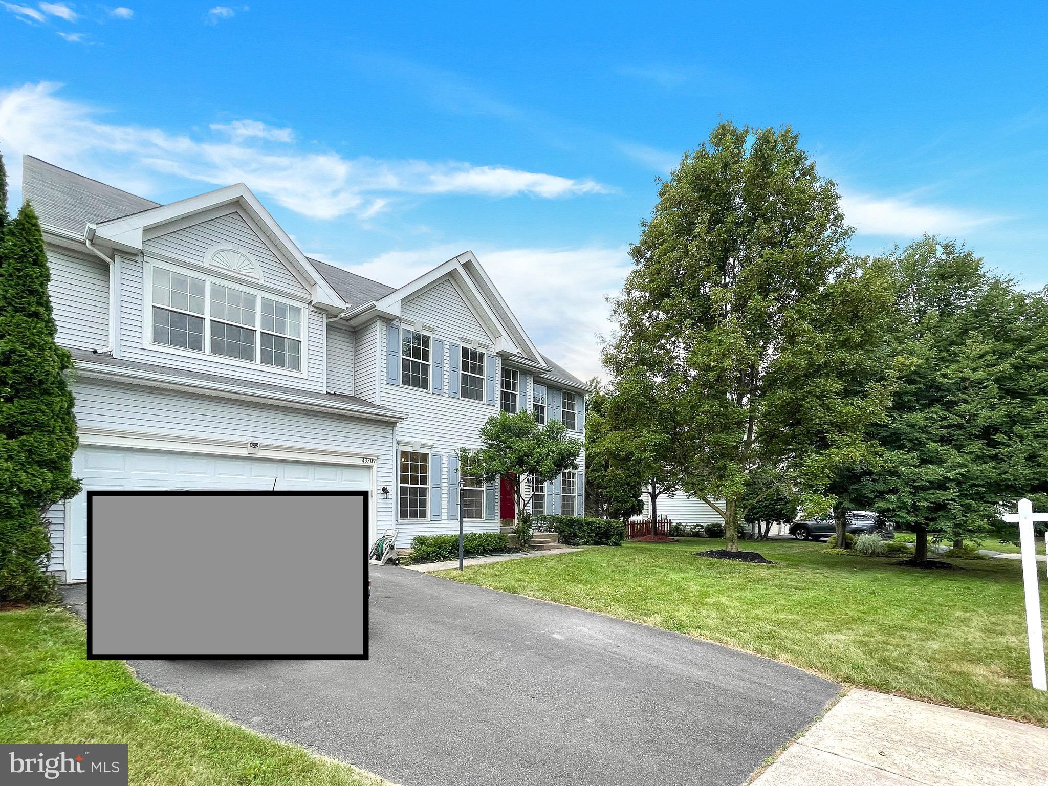 a view of house with outdoor space and garden