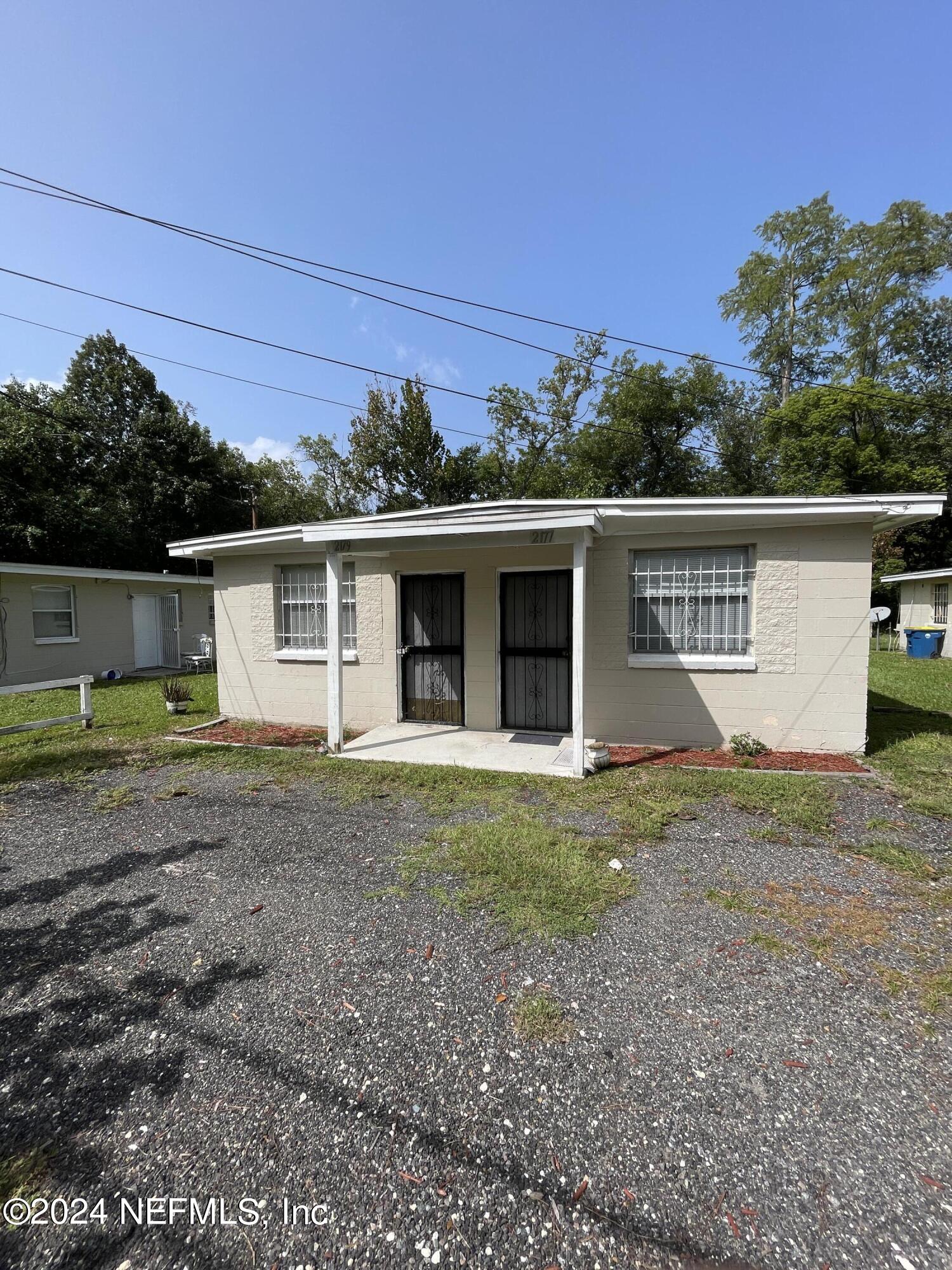 front view of a house with a yard