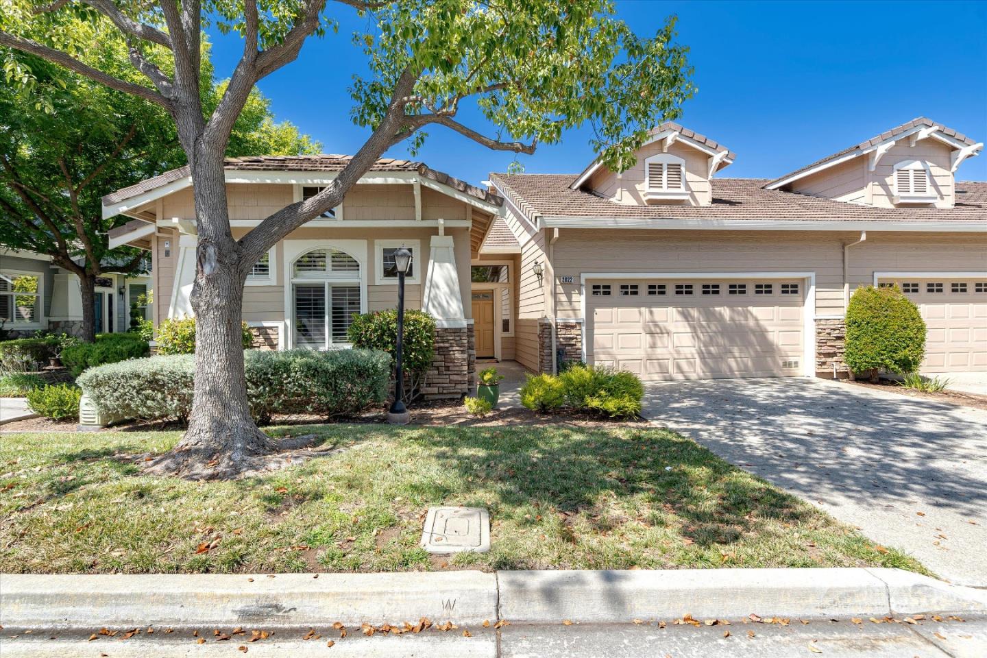 a front view of a house with garden