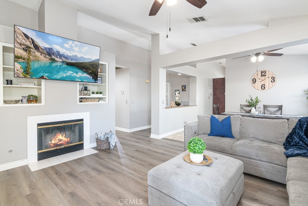 a living room with furniture and a fireplace