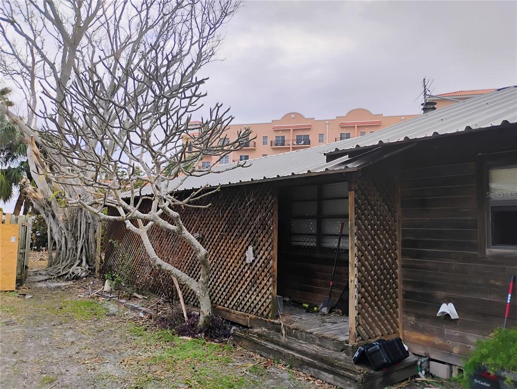 a view of a house with a tree