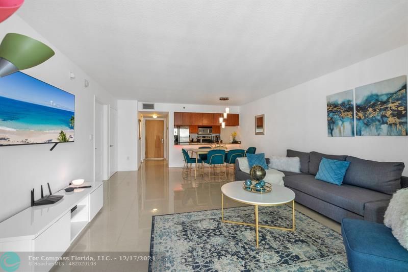 a living room with furniture and a table