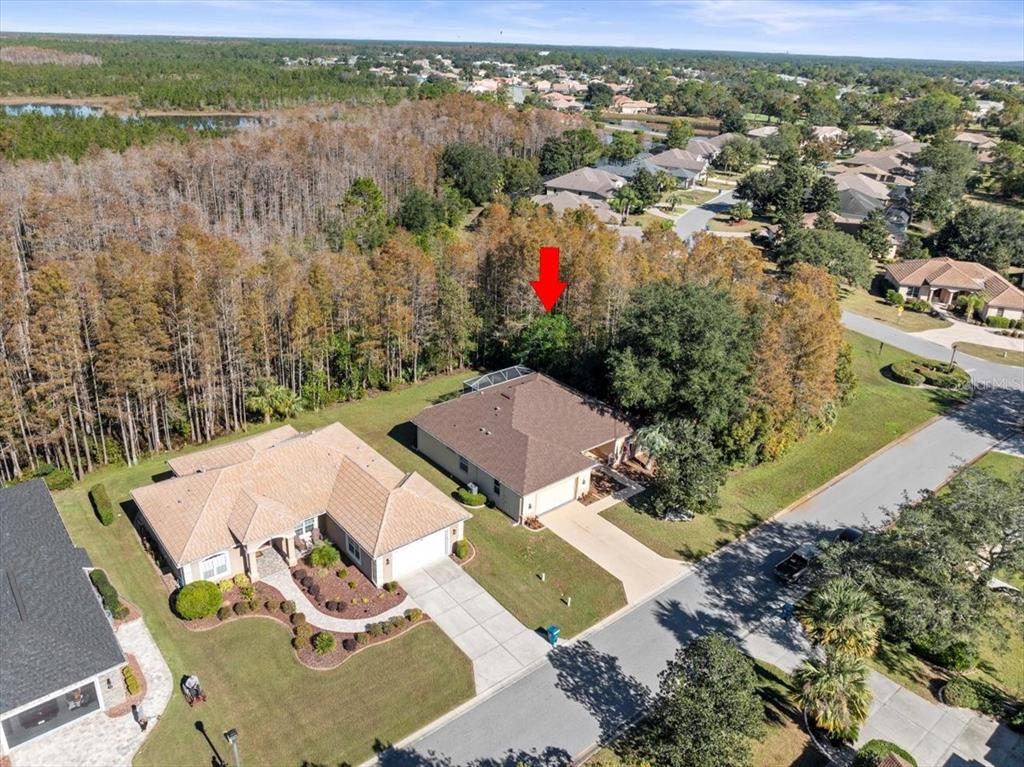 an aerial view of residential house with outdoor space and lake view