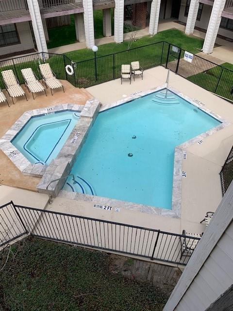 a view of a backyard with a table and chair