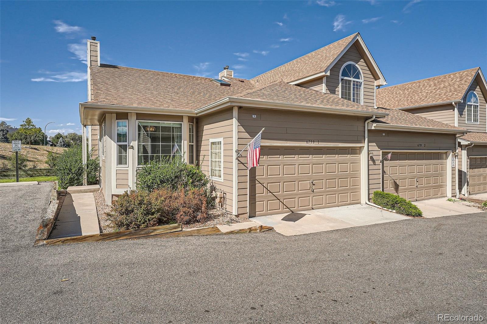 front view of a house with a patio