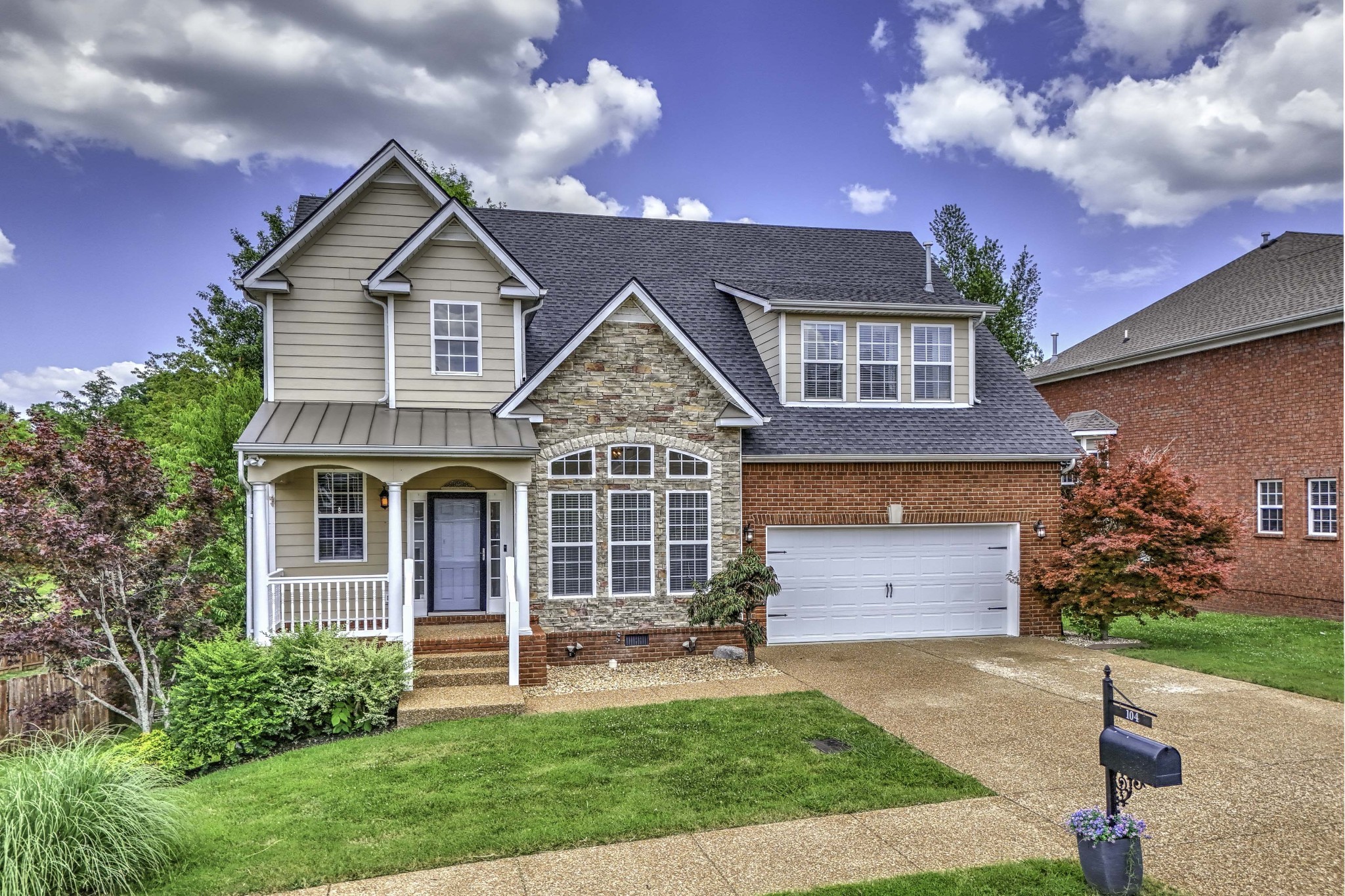 front view of a house with a yard