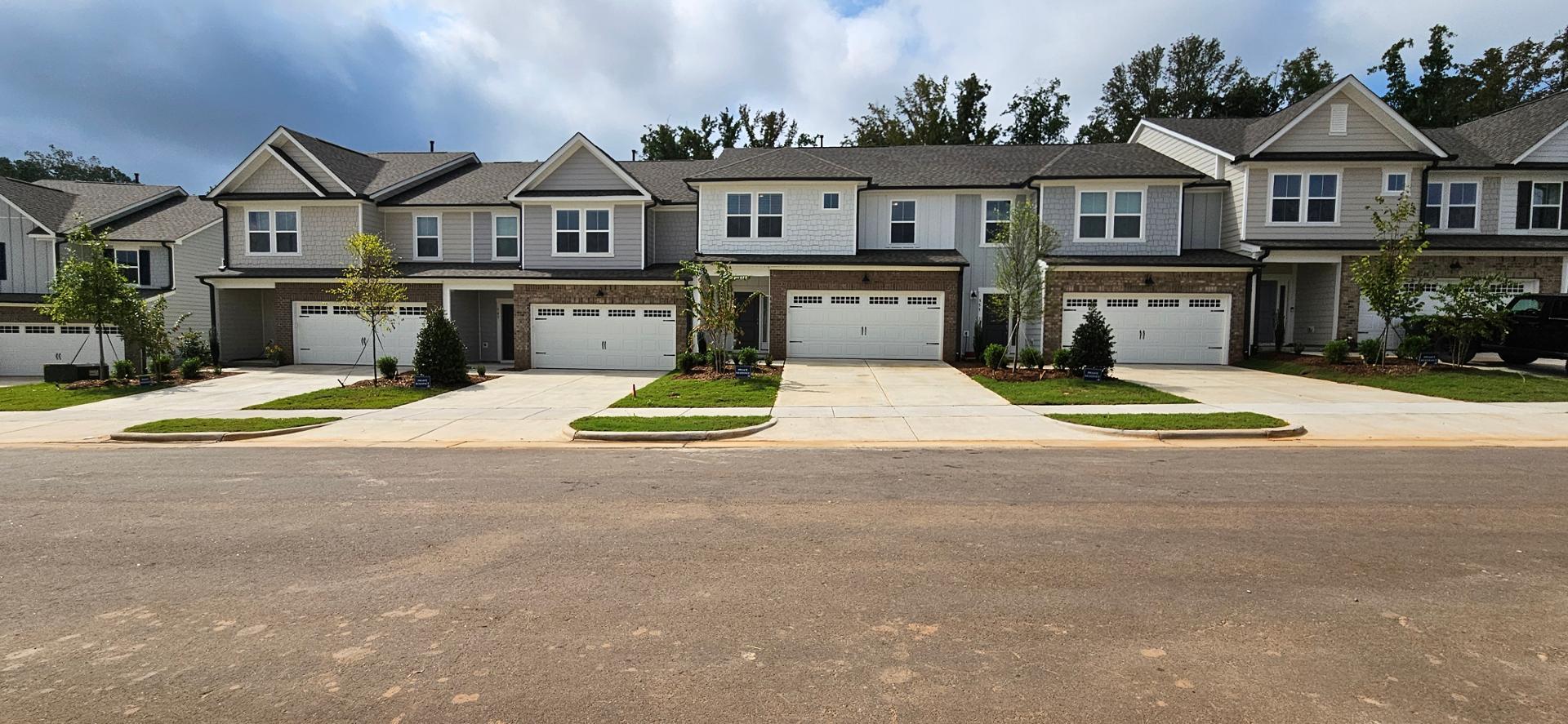 front view of a house with yard and street