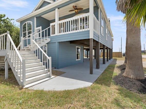 a view of a house with backyard and deck