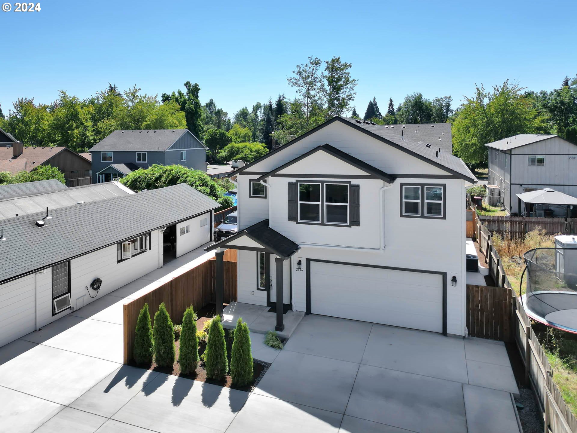 a aerial view of a house with a yard