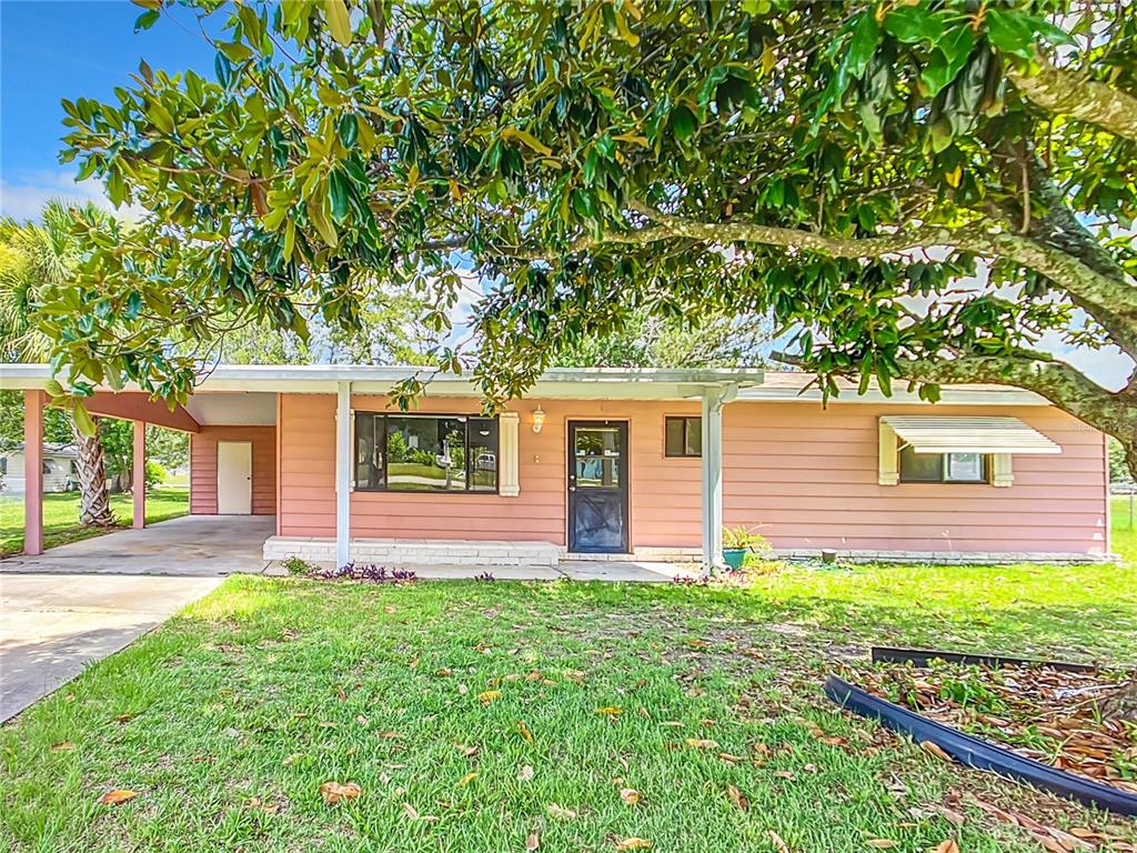 front view of a house with a yard