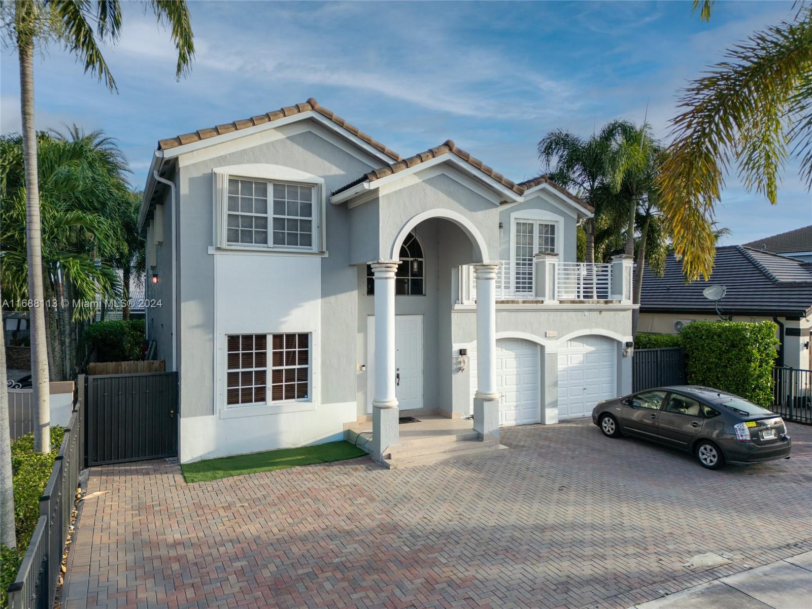 a view of a car park in front of house