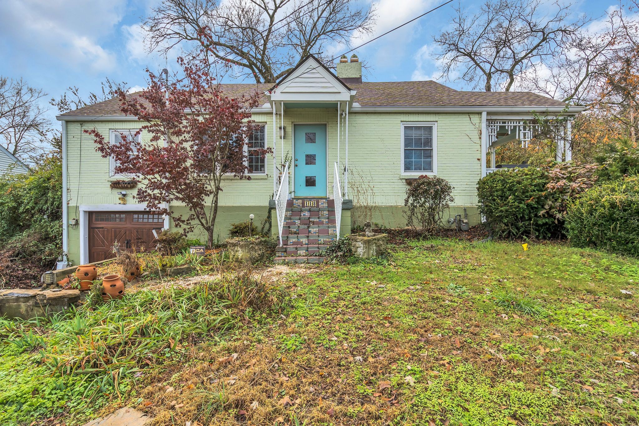 front view of a house with a garden