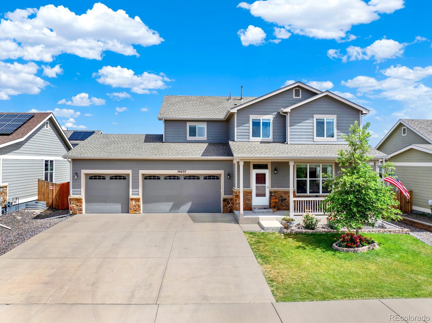 a front view of a house with yard and entertaining space