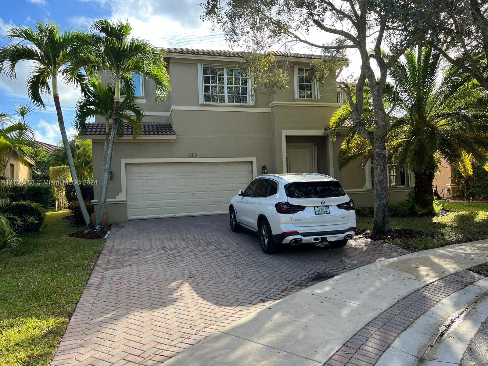 a car parked in front of a house