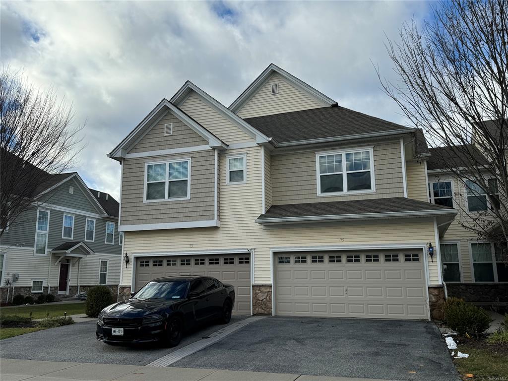 View of front of home featuring a garage