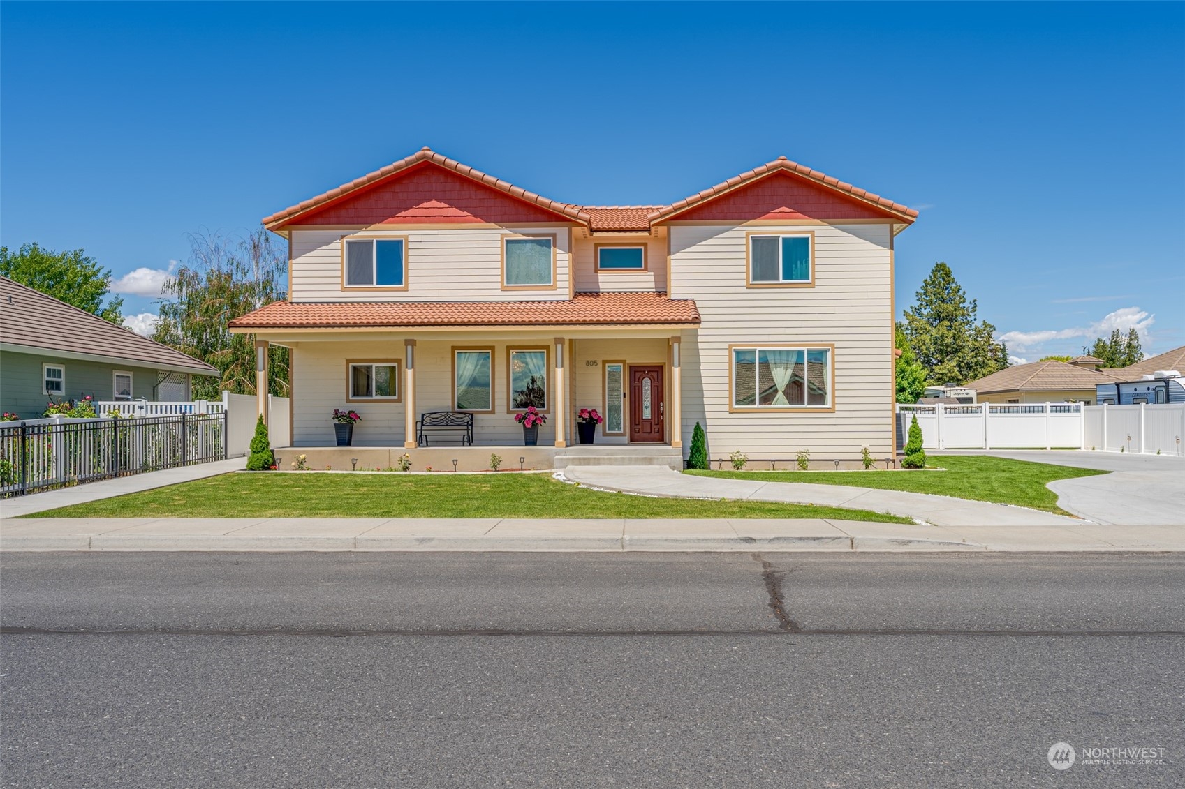 a front view of a house with a yard