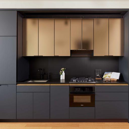 a kitchen with cabinets and appliances