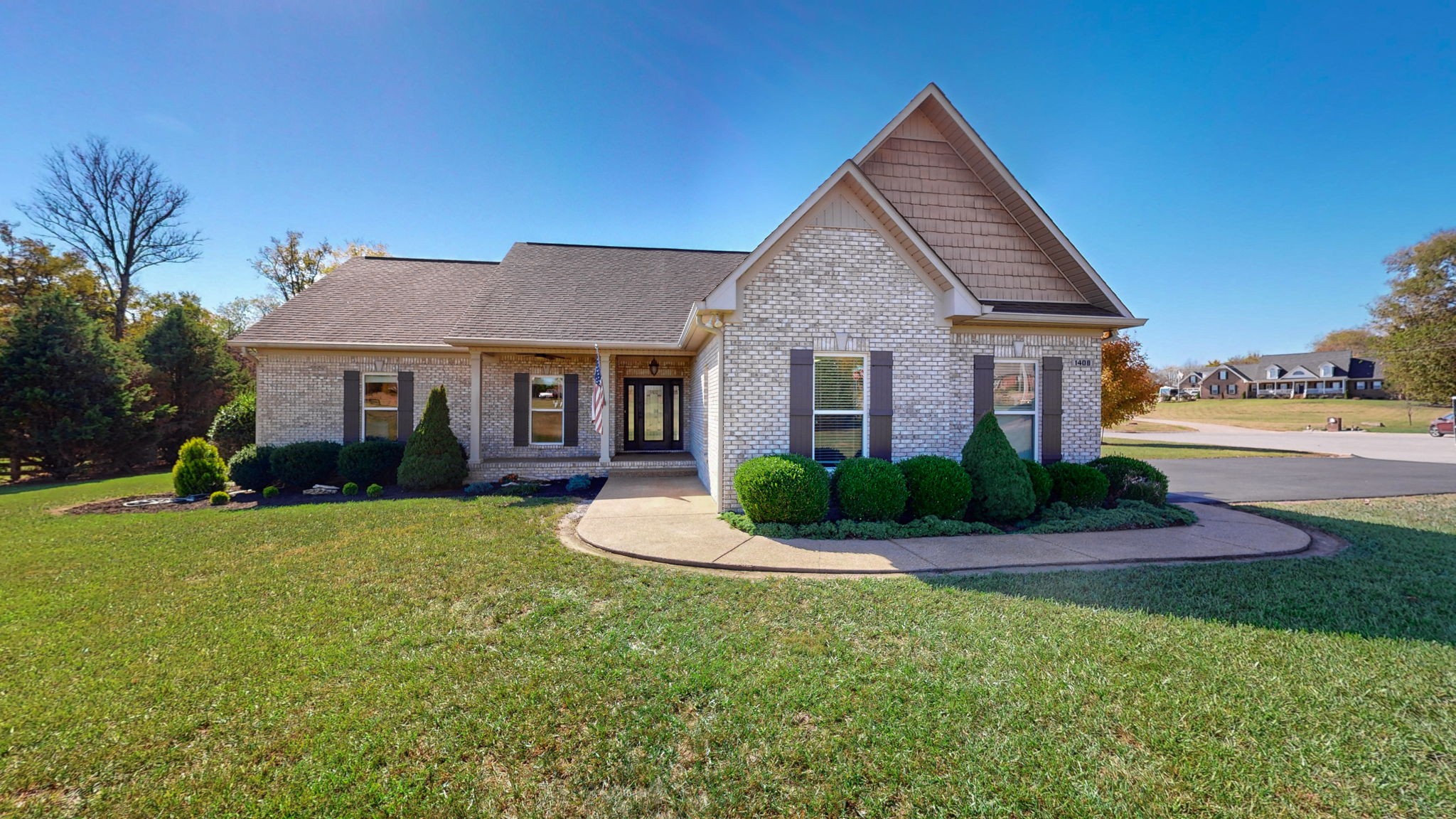 a front view of a house with a yard