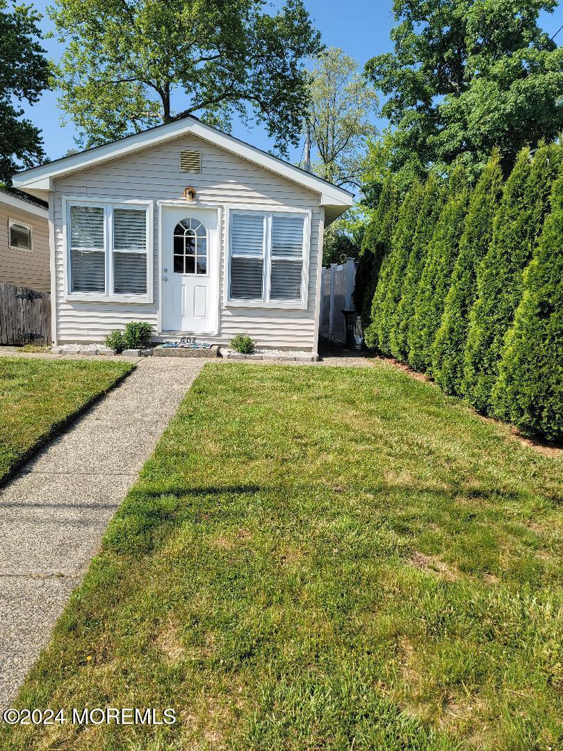 a front view of a house with yard