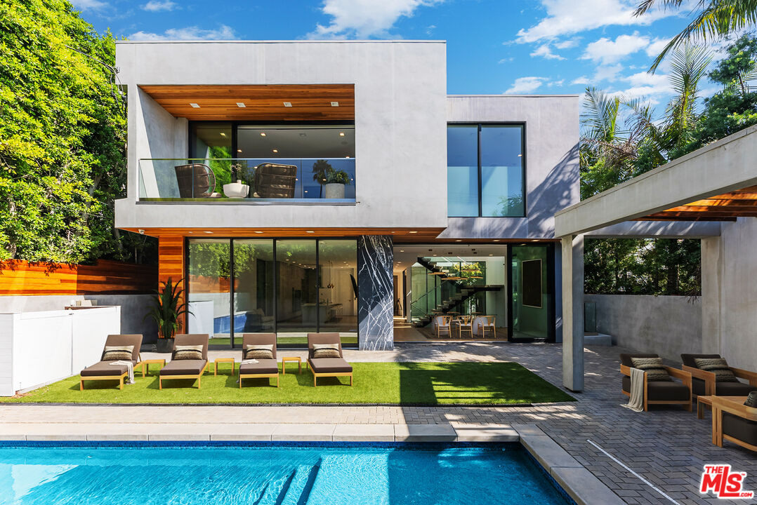 a view of a swimming pool with a patio