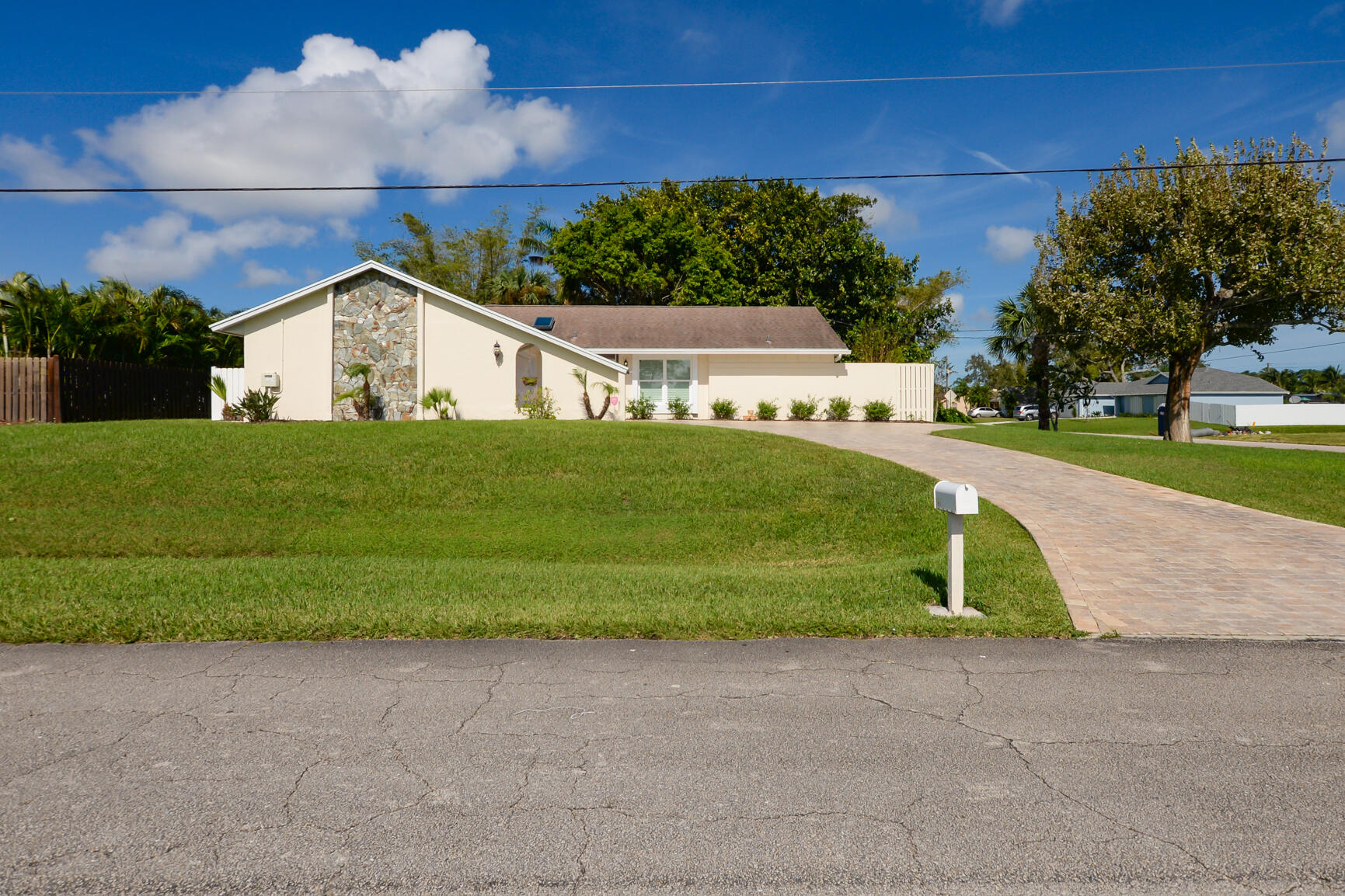 a view of a house with a yard and garage