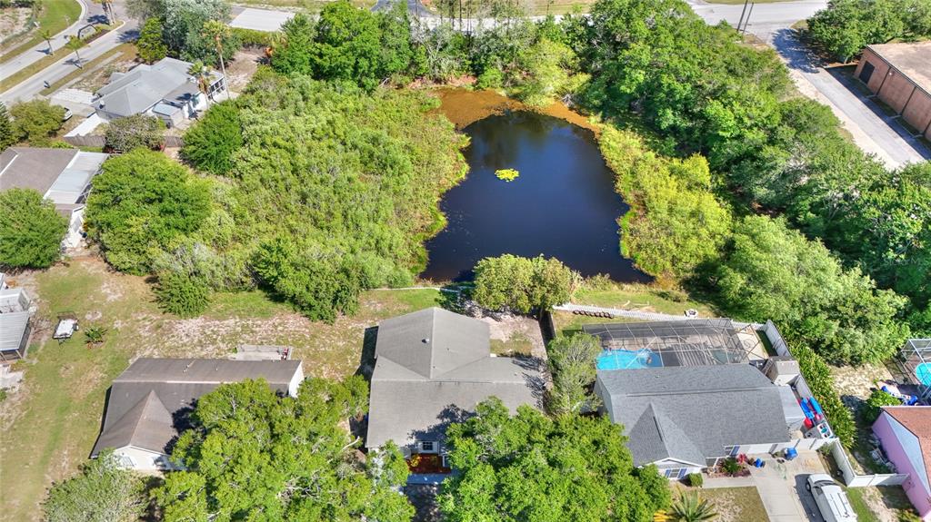 an aerial view of house with yard swimming pool and outdoor seating