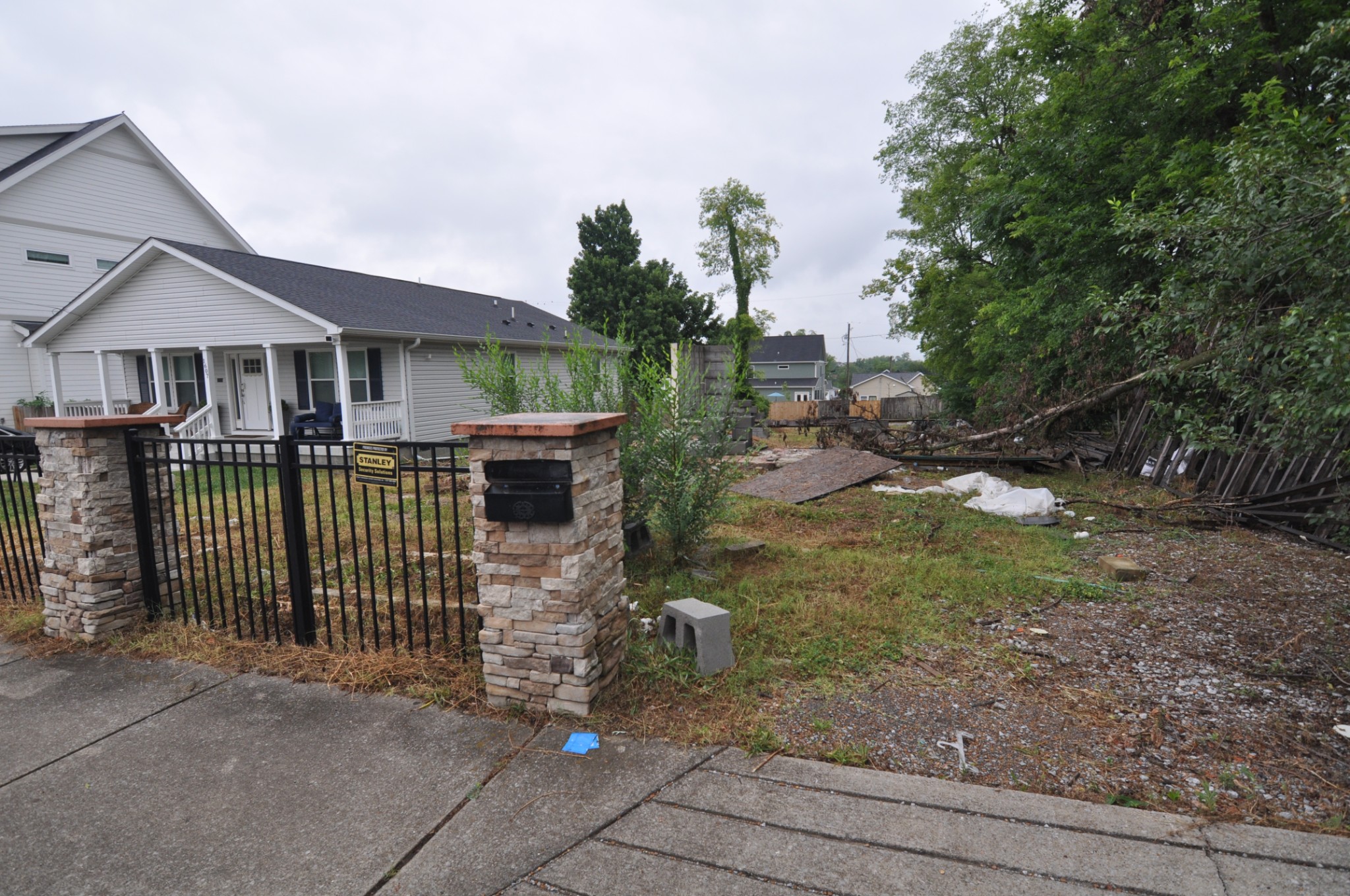 a view of a house with a small yard and plants