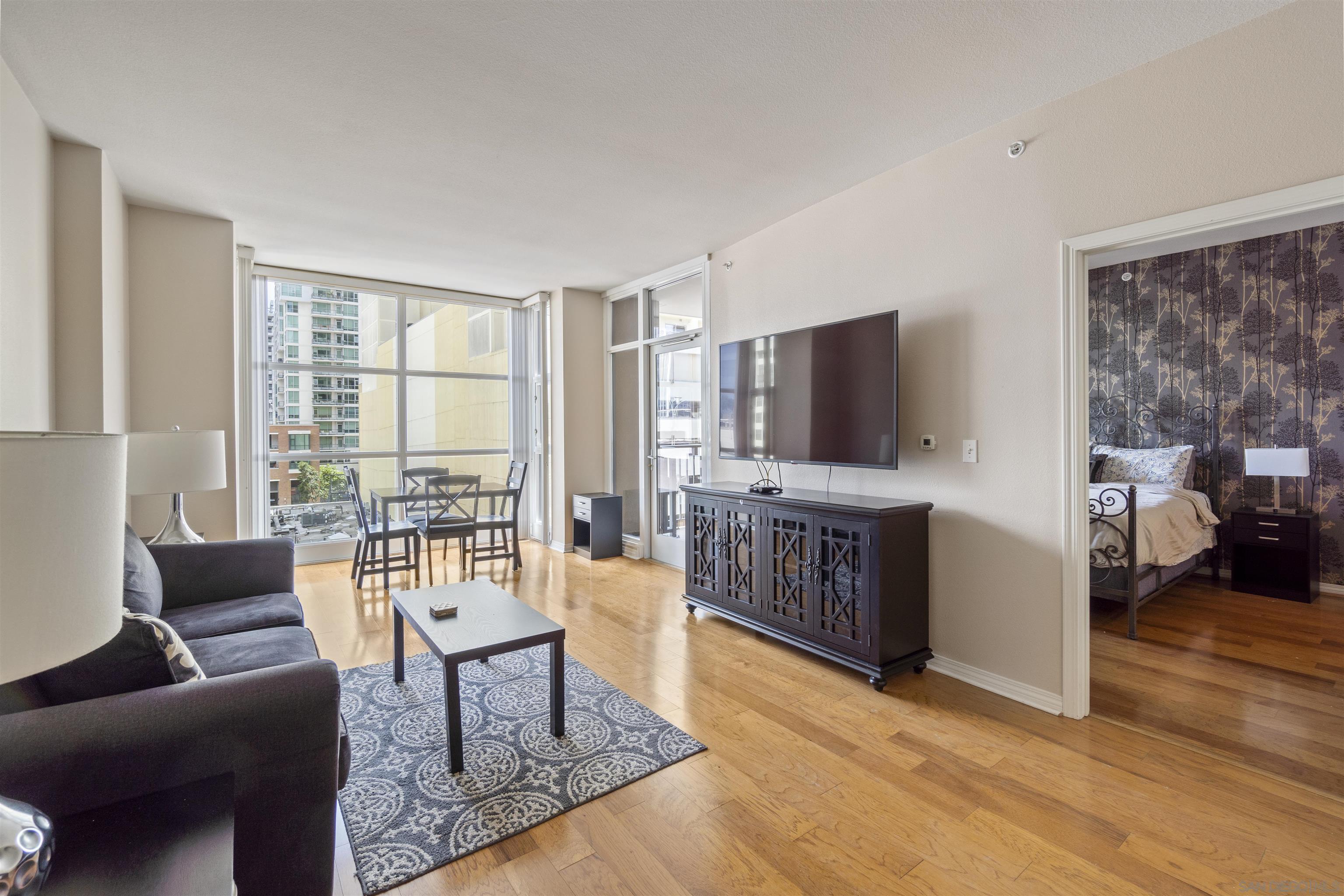 a living room with furniture and a flat screen tv