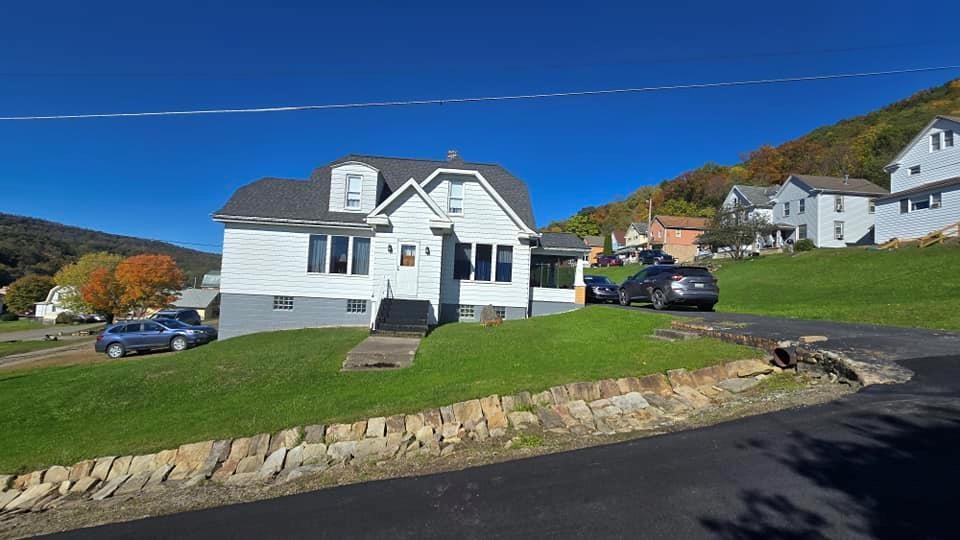 a front view of a house with a yard