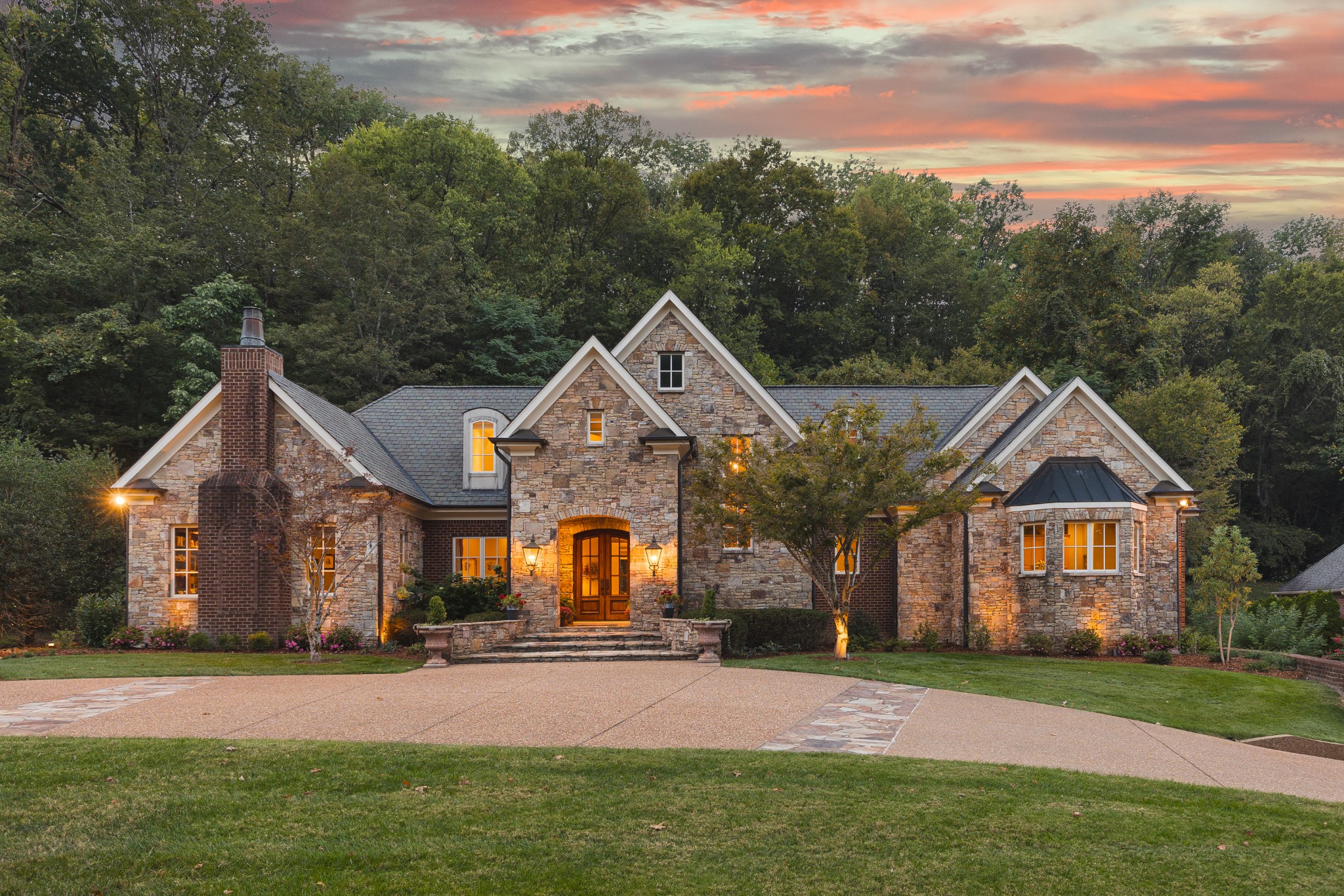 a front view of a house with a yard