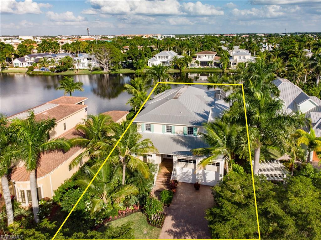 an aerial view of a house with a lake view