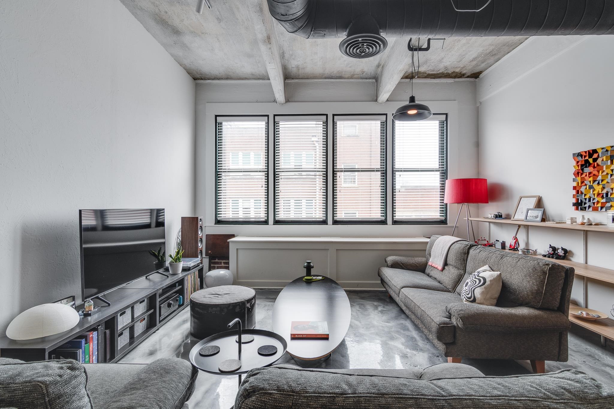 a living room with furniture fireplace and flat screen tv