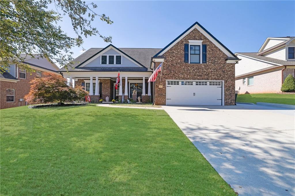 a front view of a house with a yard