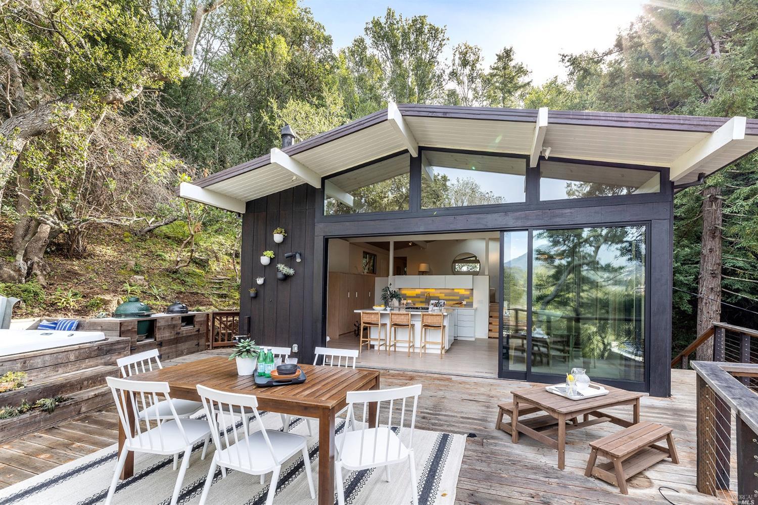 a view of patio with table and chairs potted plants with large tree