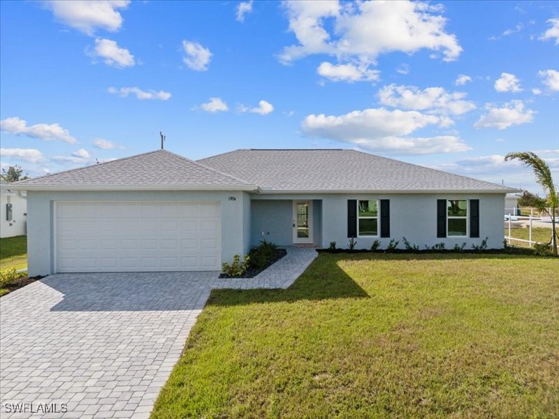 a front view of a house with yard