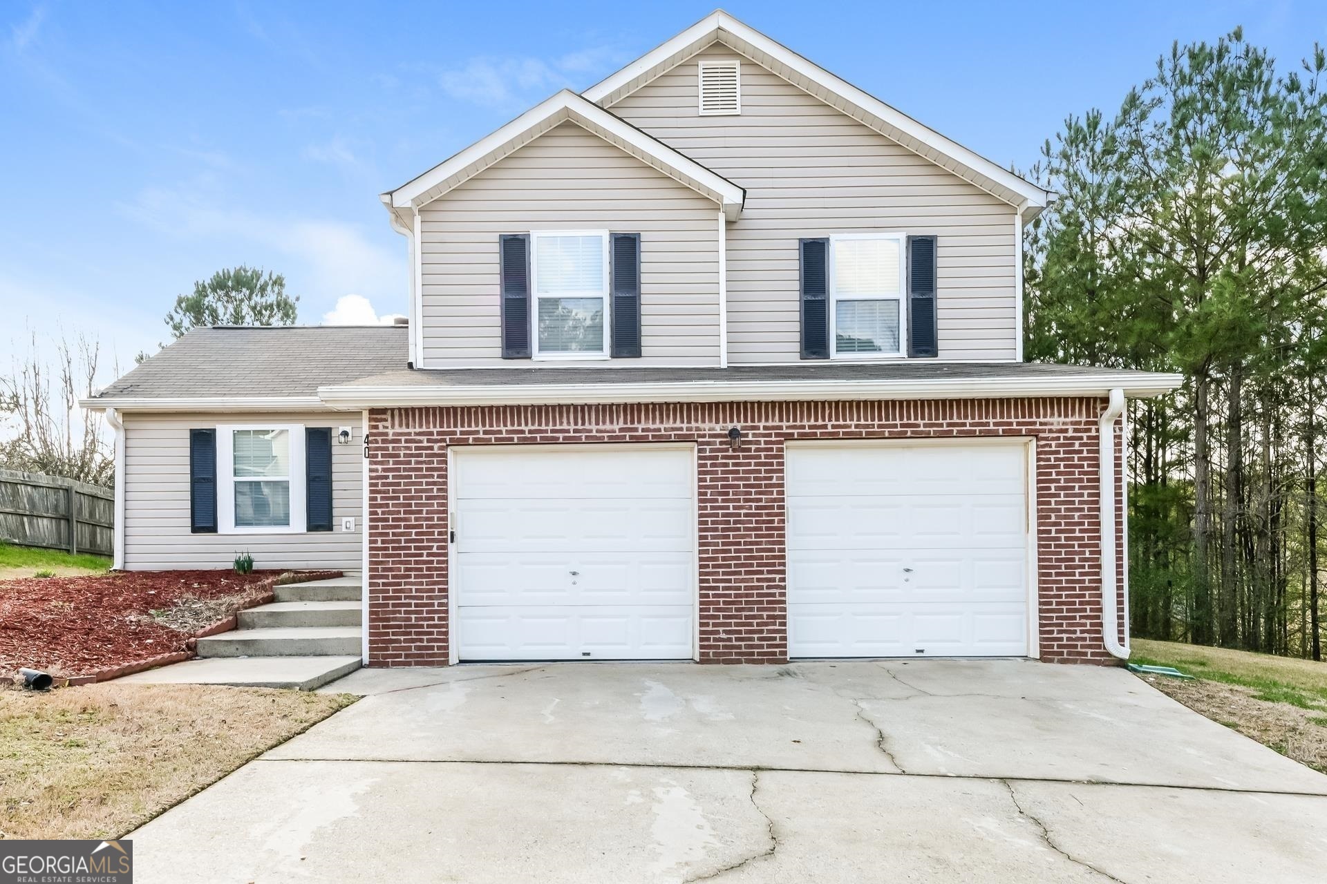 a view of house with garage