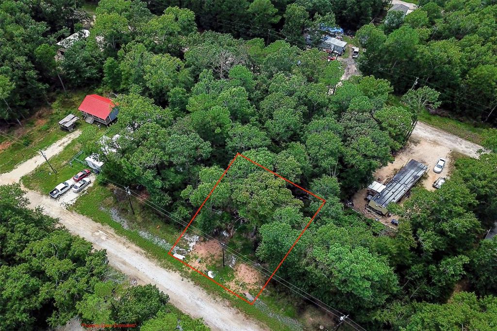 an aerial view of a house and outdoor space