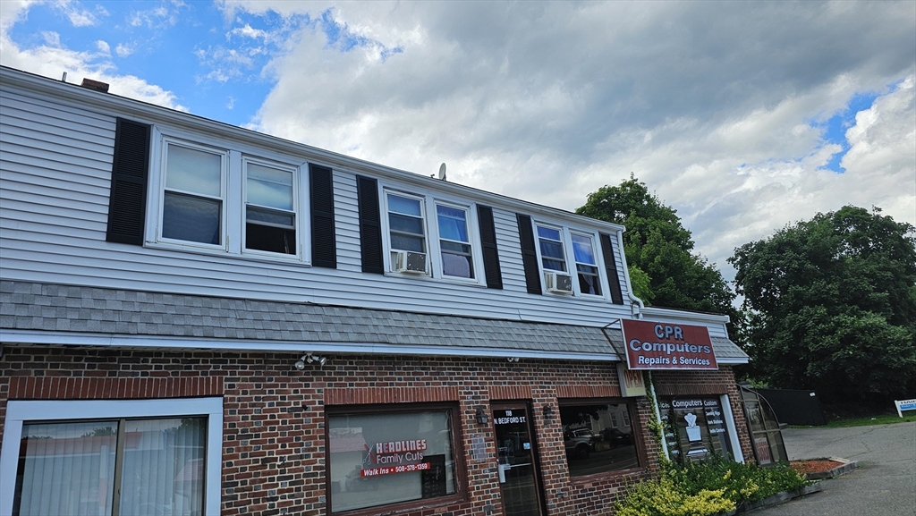 a red brick building with glass windows