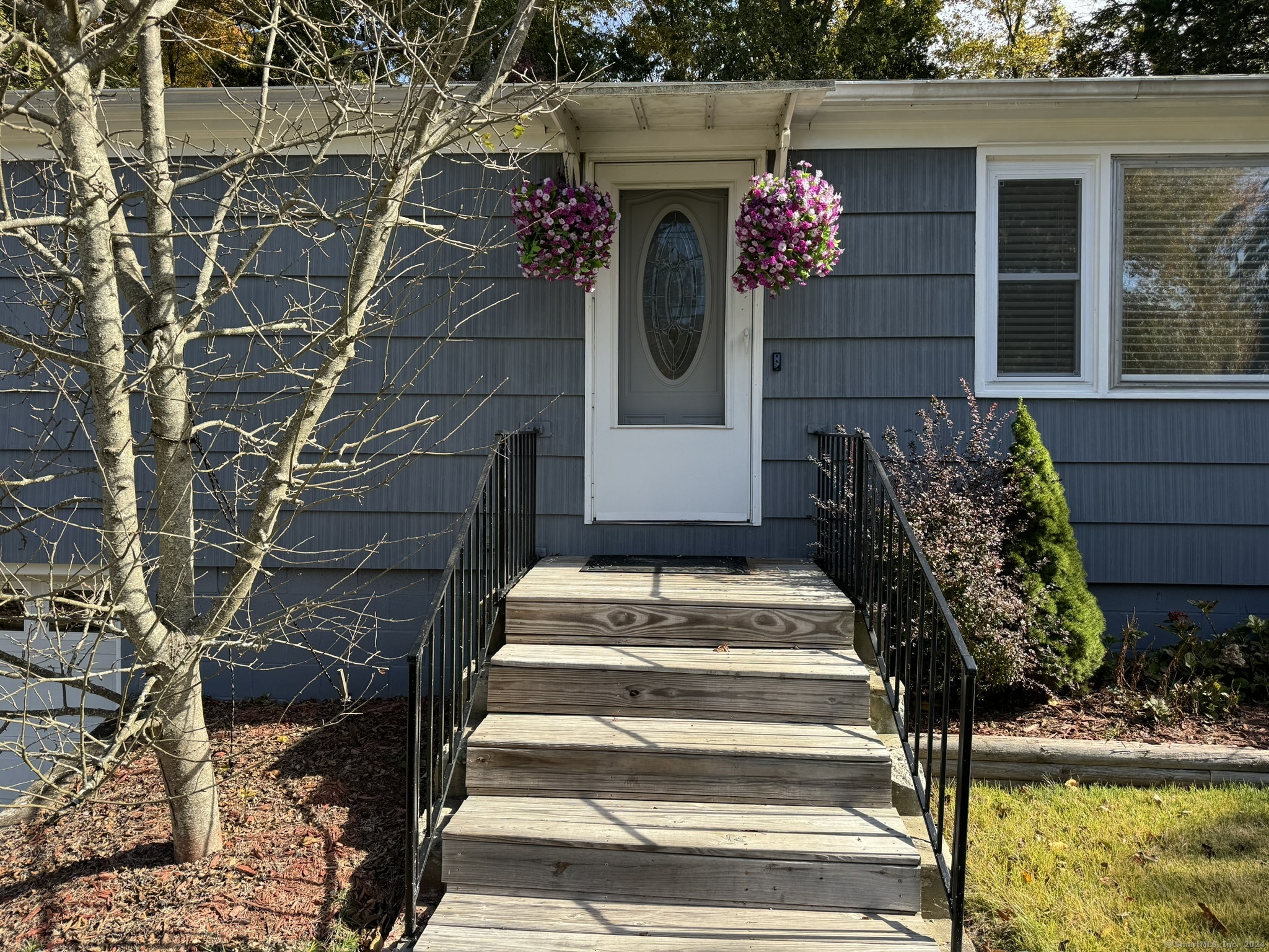 a view of entryway with flower pots