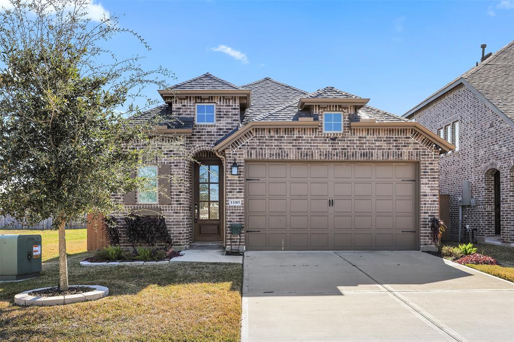 a front view of a house with garage