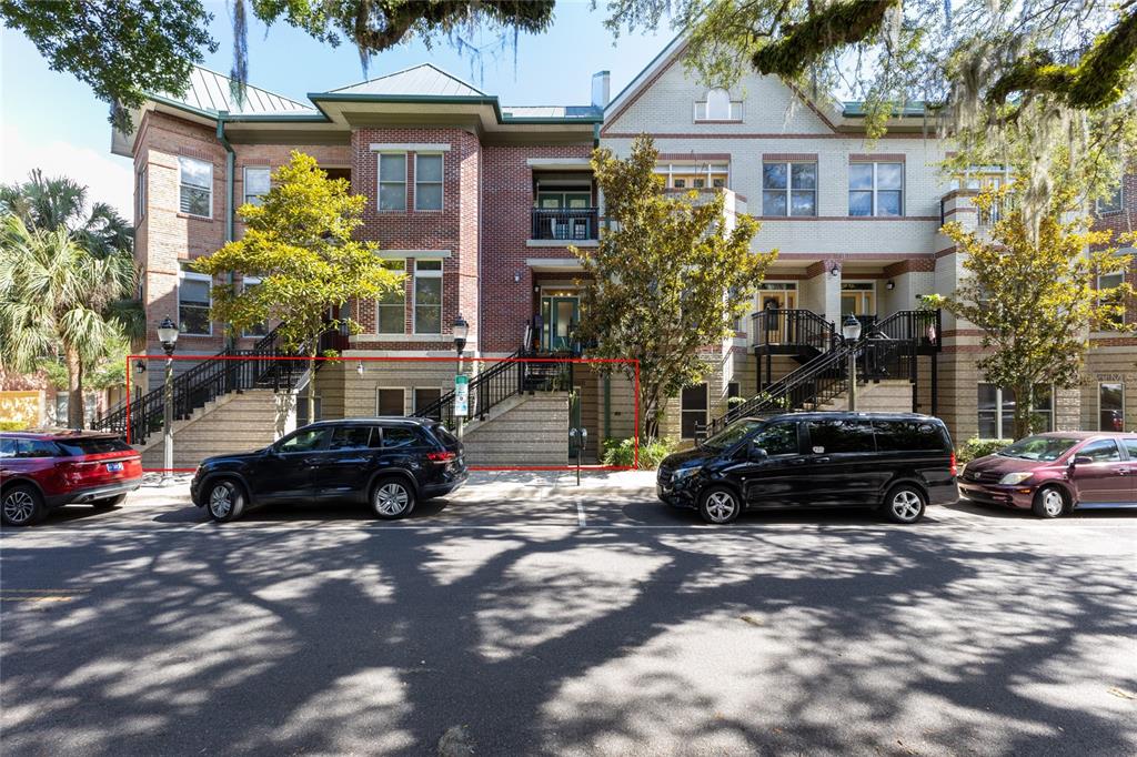 a view of a car parked in front of a houses