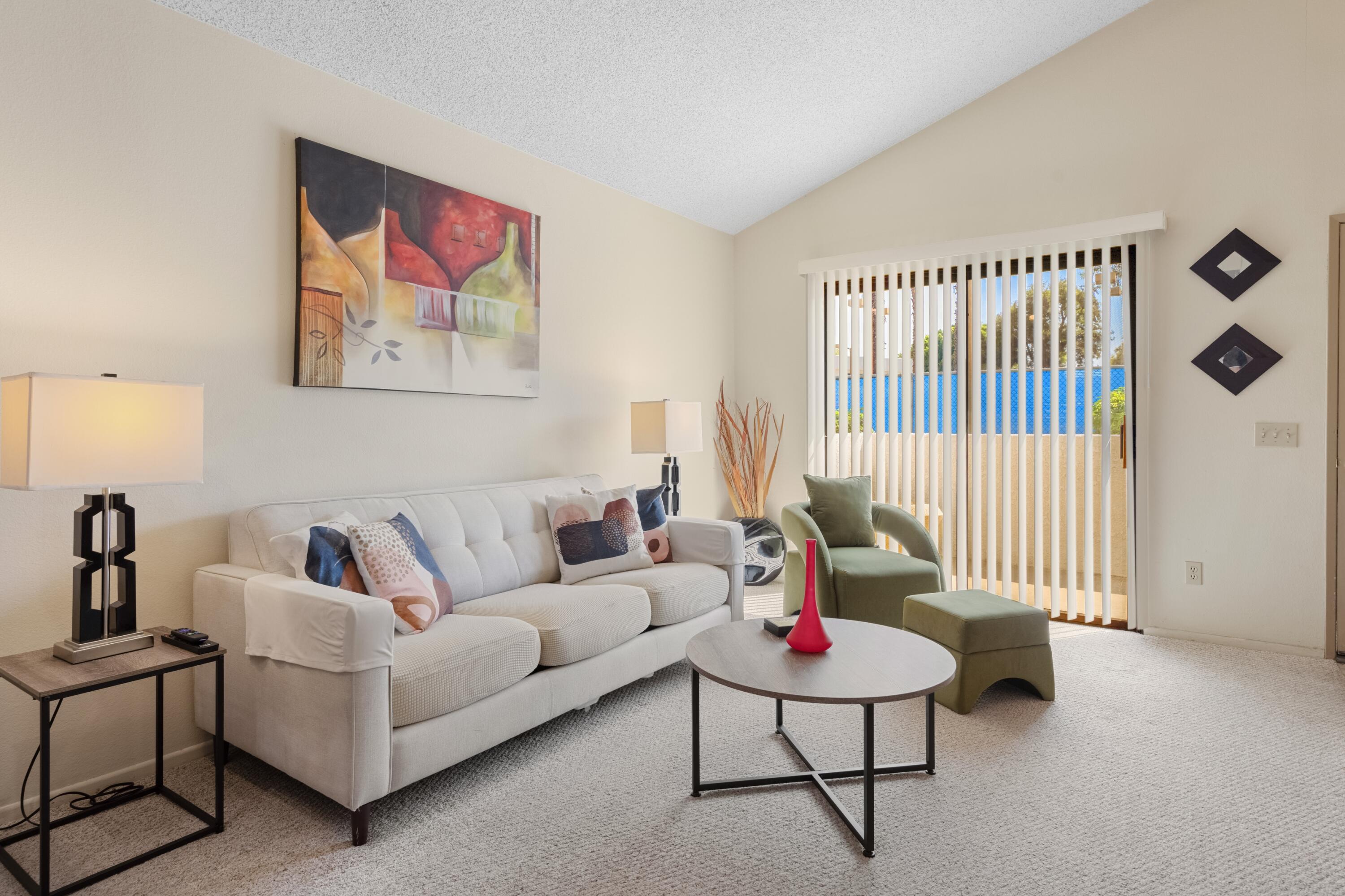 a living room with furniture and a window